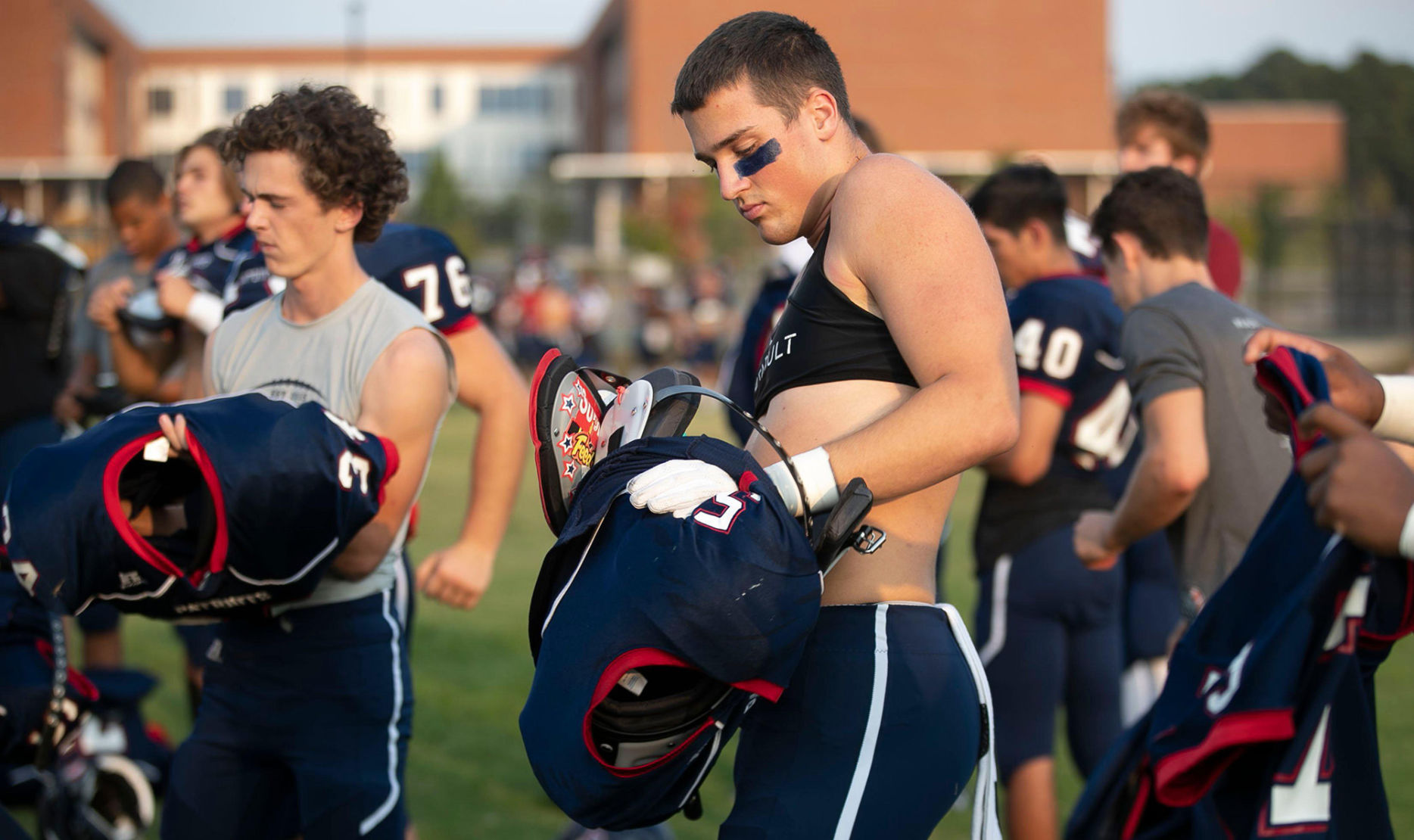 Apex Friendship defensive back Zach Johnson (5) and his teammates suit up for the conclusion of their game against Middle Creek on Monday, Sept. 30, 2019 in Apex, N.C.